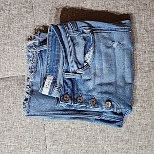 Kancan button fly bootcut.  Factory distressed. Excellent condition.